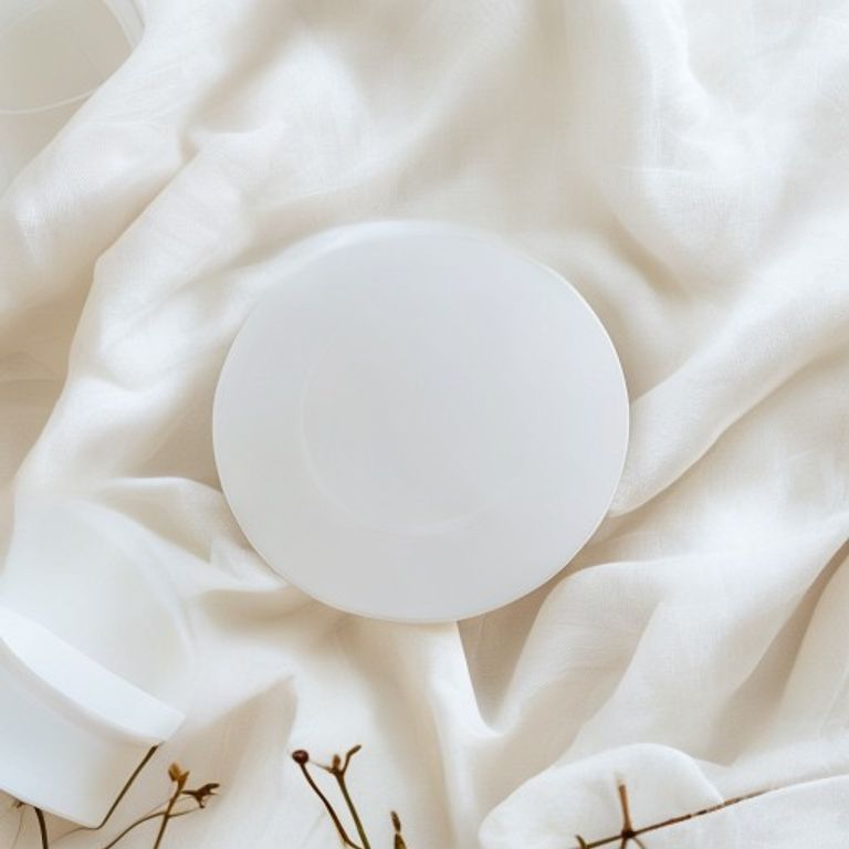 Round protective stoma shield on white linen